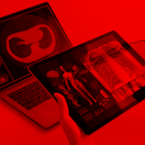 laptop and tablet with anatomy and health screens