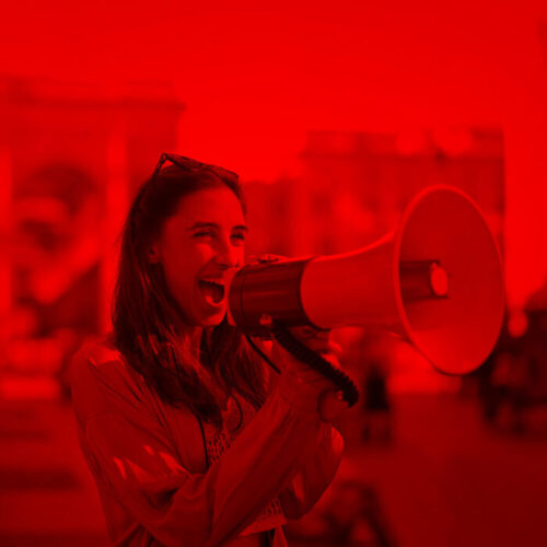 Marketing - Brunette woman shouting on a megaphone